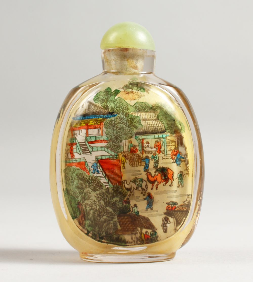 A GOOD SNUFF BOTTLE painted with a boat, buildings and figures, 8.5cm.