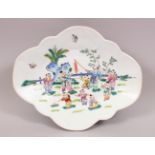 A 20TH CENTURY CHINESE FAMILLE ROSE PORCELAIN FOOTED DISH, the dish decorated with scenes of boys