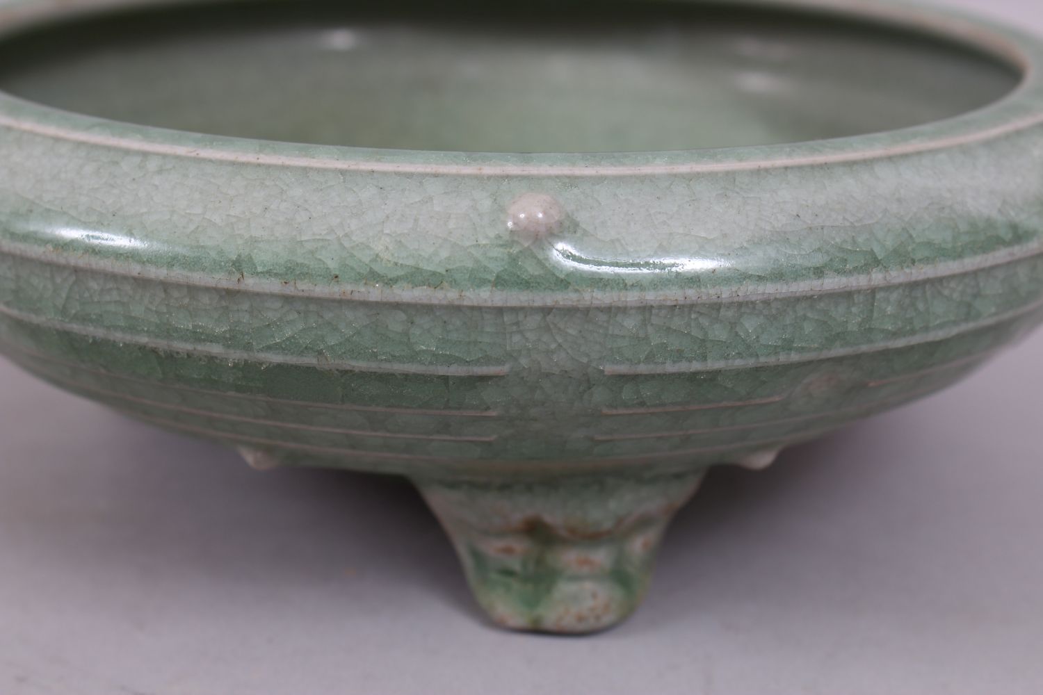 A GOOD CHINESE SONG STYLE PALE CELADON GROUND TRIPLE FOOT CENSOR, the body with moulded studs, the - Image 4 of 7