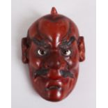 A LARGER JAPANESE MEIJI PERIOD PAPER MACHE / LACQUER NOH MASK, With inlaid eyes and painted