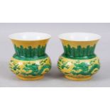 A GOOD PAIR OF CHINESE YELLOW GROUND FAMILLE VERTE PORCELAIN DRAGON BOWLS, the exterior decorated