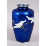 A GOOD JAPANESE TAISHO /SHOWA PERIOD GINBARI CLOISONNE VASE, the blue ground body with twin flying