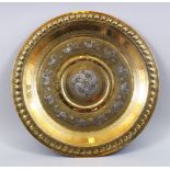 A GOOD 19TH CENTURY INDO PERSIAN SILVER METAL ONLAID BRASS CHARGER, silver metal onlay depicting