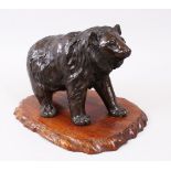 A GOOD JAPANESE MEIJI PERIOD BRONZE BEAR OKIMONO, The bear in a striding pose and realistically