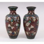 A PAIR OF JAPANESE MEIJI PERIOD CLOISONNE VASES, a gold dust ground decorated with scenes of