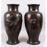 A PAIR OF LARGE JAPANESE MEIJI PERIOD BRONZE CRANE VASES, the large baluster shaped bronze vases