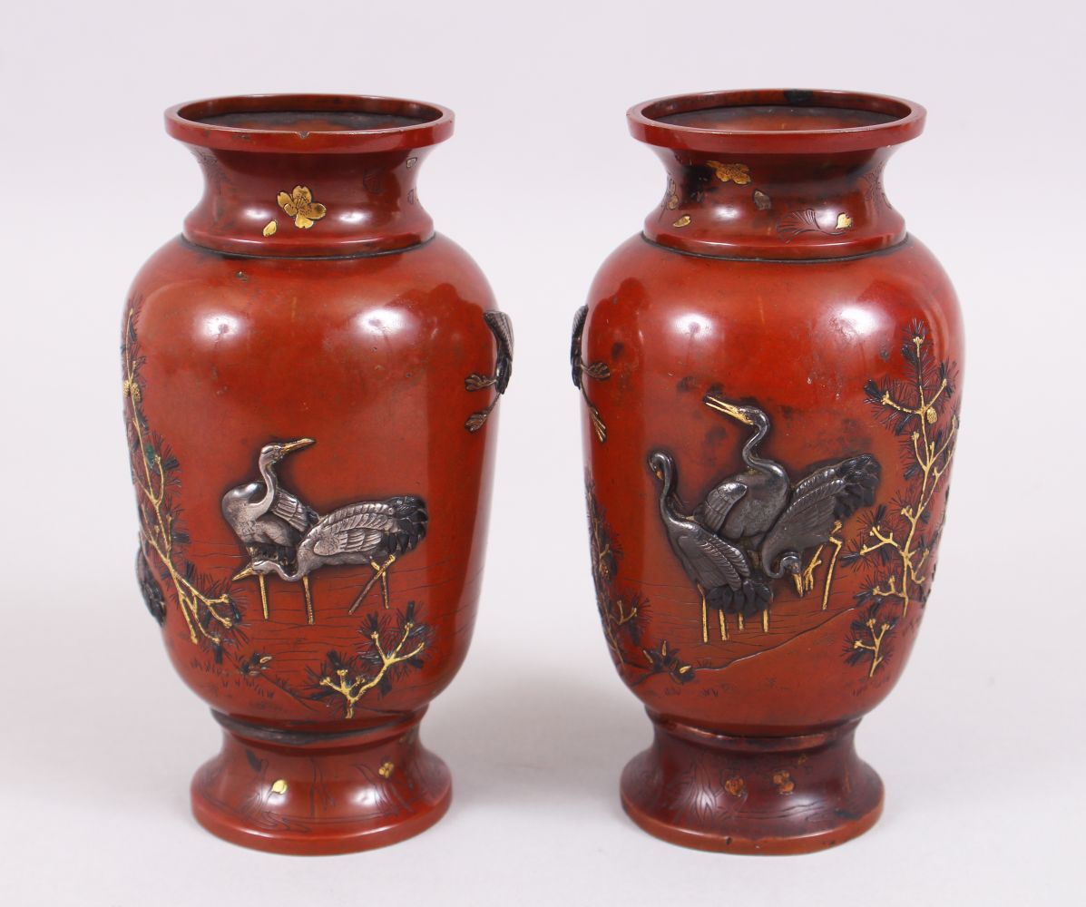 A GOOD PAIRT OF JAPANESE MEIJI PERIOD BRONZE & MIXED METAL ONLAID VASES, depicting scenes of