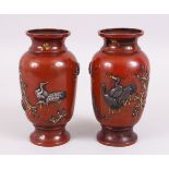 A GOOD PAIRT OF JAPANESE MEIJI PERIOD BRONZE & MIXED METAL ONLAID VASES, depicting scenes of