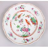 A GOOD 18TH CENTURY CHINESE FAMILLE ROSE PORCELAIN PLATE, decorated with scenes of birds amongst