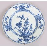 A GOOD 18TH CENTURY CHINESE BLUE & WHITE PORCELAIN PLATE, decorated with floral scenes, mounted with