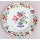 A GOOD 18TH CENTURY CHINESE FAMILLE ROSE PORCELAIN PLATE, decorated with scenes floral display, 22.
