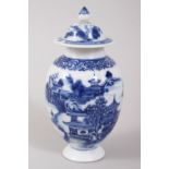 A GOOD CHINESE BLUE AND WHITE PORCELAIN TEA CADDY AND COVER, decorated with landscape scenes, 14cm