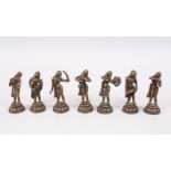 A MIXED LOT OF SEVEN 19TH / 20TH CENTURY INDIAN BRONZE MUSICIAN FIGURES, each holding a different