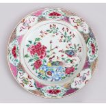 A GOOD 18TH CENTURY CHINESE FAMILLE ROSE PORCELAIN PLATE, decorated with scenes of birds amongst