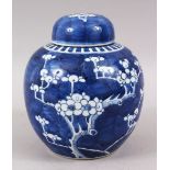 A 19TH CENTURY CHINESE BLUE & WHITE PORCELAIN PRUNUS GINGER JAR & COVER, the base with double blue