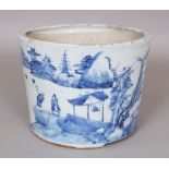A CHINESE BLUE & WHITE PORCELAIN BRUSHPOT, the flaring sides painted with a continuous river