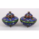 A PAIR OF 20TH CENTURY CHINESE CLOISONNE CENSERS & COVERS, the body decorated ith formal foliage