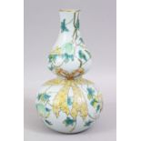 A GOOD CHINESE FAMILLE ROSE PORCELAIN DOUBLE GOURD SHAPED VASE, the body with raised decoration of a