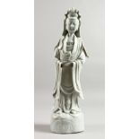 A 19TH CENTURY CHINESE BLANC-DE-CHINE FIGURE OF GUANYIN, 14ins high.