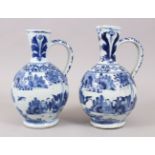 A GOOD PAIR OF CHINESE 16TH / 17TH CENTURY TRANSITIONAL BLUE & WHITE PORCELAIN JUGS, decorated