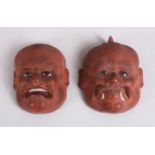 TWO JAPANESE MEIJI PERIOD CARVED PAPER MACHE / LACQUER NOH MASKS, with inlaid eyes, 6.5cm each.