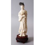 A 19TH CENTURY CHINESE CARVED IVORY FIGURE OF GUANYIN, stood upon a fitted and carved hardwood base,