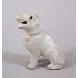 A CHINESE KANGXI BLANC DE CHINESE STYLE MODEL OF A HOUND, in a seated position with head to one