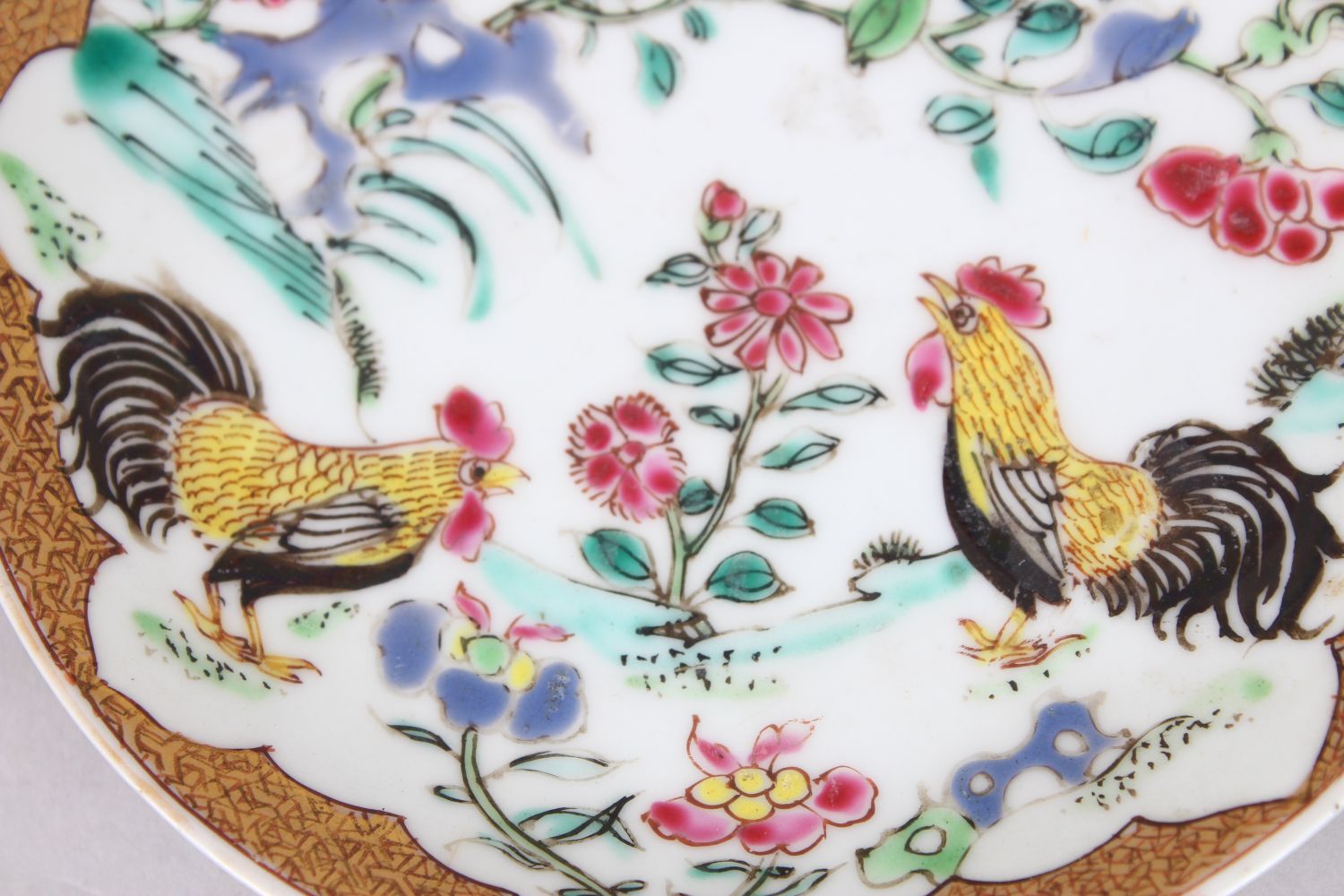AN 18TH CENTURY CHINESE FAMILLE ROSE PORCELAIN SAUCER, painted to depict birds amongst flora, 11. - Image 2 of 3