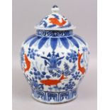 A CHINESE BLUE & WHITE PORCELAIN CARP GINGER JAR AND COVER, the body of the jar decorated with