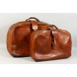 A GUCCI BROWN LEATHER SUITCASE, Circa. 1965, together with a matching smaller case. Approx. Size:
