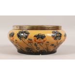 A MOORCROFT McINTYRE CIRCULAR POPPY DESIGN BOWL with silver band by John Grinstead & Son. 10ins