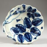 AN 18TH CENTURY WORCESTER TWIG HANDLED SCALLOPED CIRCULAR DISH, moulded with two flower buds and