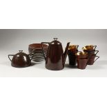 A LIMOGES PORCELAIN PART COFFEE SERVICE, brown glazed, comprising coffee pot, sucrier, eight cups