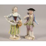 A GOOD PAIR OF MEISSEN FIGURES OF A YOUNG BOY AND GIRL, both carrying flowers. Cross swords mark