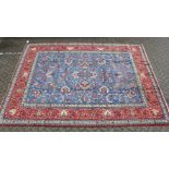 A GOOD LARGE PERSIAN ISFAHAN CARPET, pale blue ground with allover floral design, in a similar red
