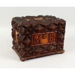 AN UNUSUAL HEAVILY CARVED CAMPHOR WOOD BOX, the front with initials MB. 13ins wide.