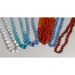 SIX VARIOUS GLASS BEAD NECKLACES.