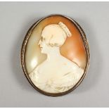 A CAMEO BUCKLE, carved with the likeness of a young Queen Victoria. 2.25ins high.