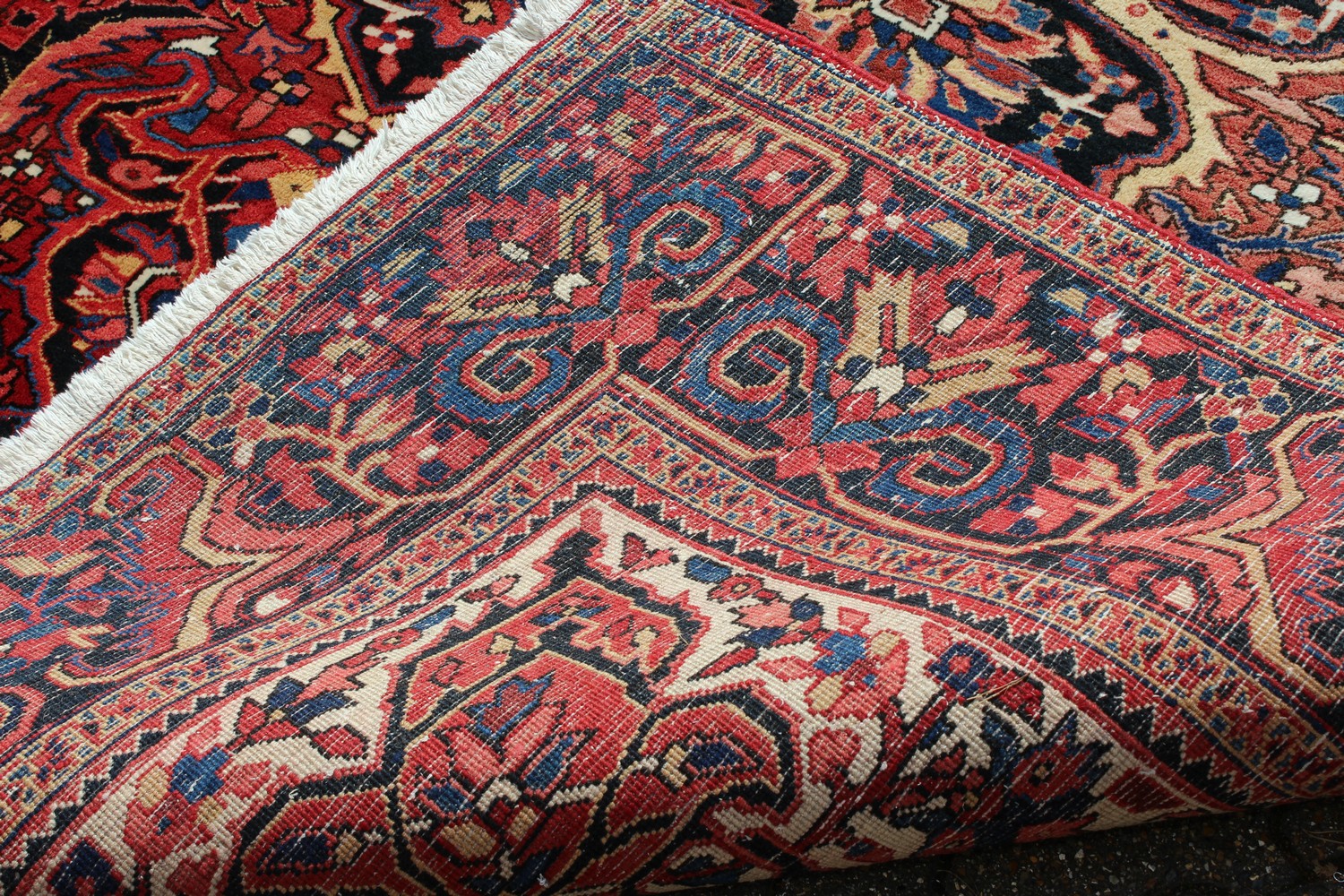 A PERSIAN STYLE HERIZ CARPET, 20TH CENTURY, red ground with allover stylised floral decoration (some - Image 8 of 9