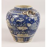 A BULBOUS BLUE AND WHITE JAR, decorated with carp. 10ins high.