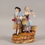 A GOOD MEISSEN GROUP OF A YOUNG MAN AND GIRL, with basket of fruit and flowers. Cross swords mark in