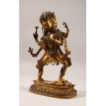 A GILT BRONZE MULTI-ARM GOD, inset with coral and turquoise stones. 11.5ins high.