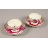 A RARE PAIR OF 18TH CENTURY ZURICH PORCELAIN TEA BOWLS AND SAUCERS, puce decoration depicting