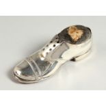 A SILVER SHOE PIN CUSHION. 4.5ins long. Chester 1912.