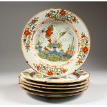 A SET OF SIX 19TH CENTURY DELFT POLYCHROME DECORATED CIRCULAR PLATES, painted with flowers. 9.5ins