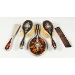 A SUPERB TORTOISESHELL AND PIQUE SILVER FIVE-PIECE DRESSING TABLE SET, hand mirror, comb, shoe