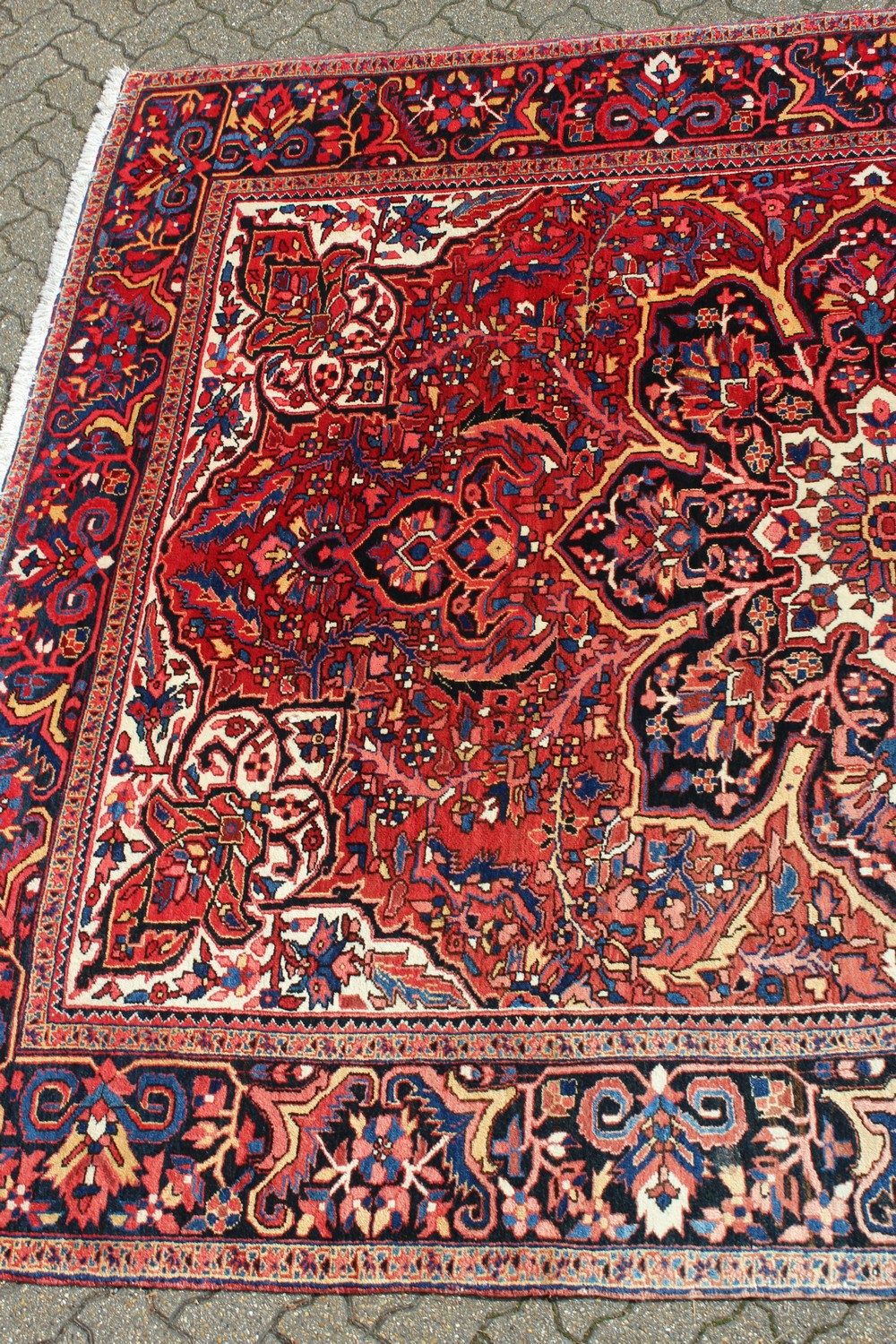 A PERSIAN STYLE HERIZ CARPET, 20TH CENTURY, red ground with allover stylised floral decoration (some - Image 4 of 9