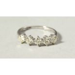 A GOOD 18CT WHITE GOD FIVE-STONE DIAMOND RING.