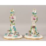 A GOOD LARGE PAIR OF MEISSEN CANDLESTICKS, painted with flowers and butterflies and encrusted with