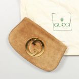 A GUCCI TAN SUEDE BAG, in a Gucci bag.